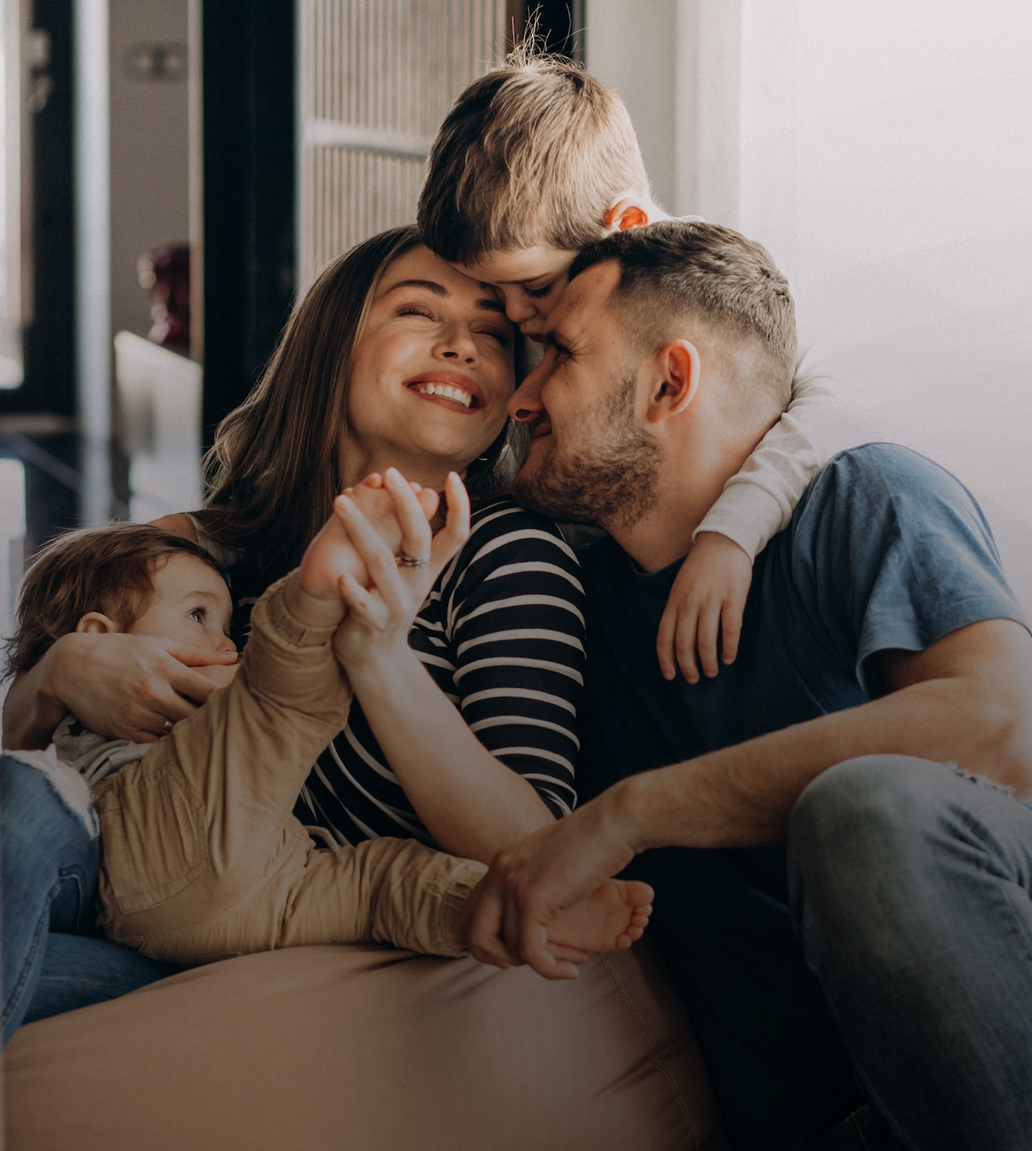 young-family-with-their-sons-home-having-fun
